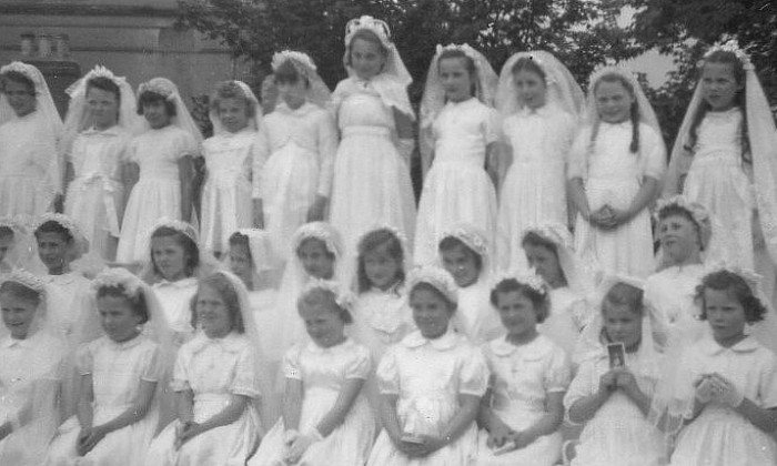 A First Communion group photographed in the mid-twentieth century